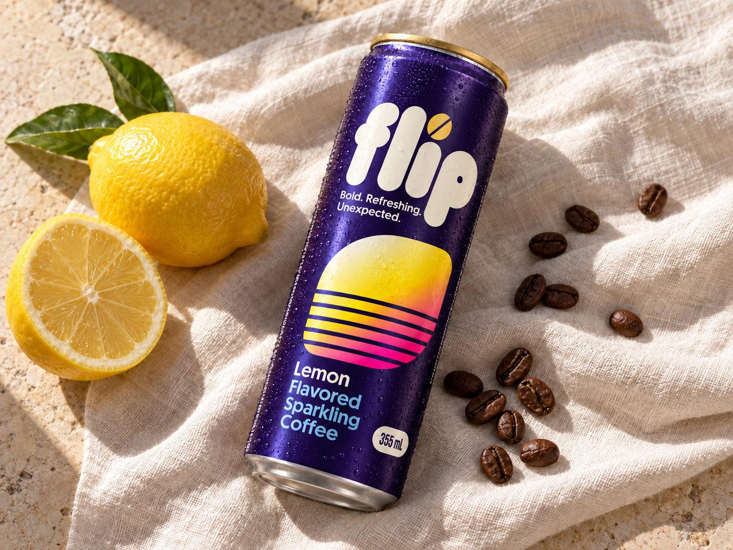 Campaign imagery: FLIP Lemon can on linen beside lemons and coffee beans
