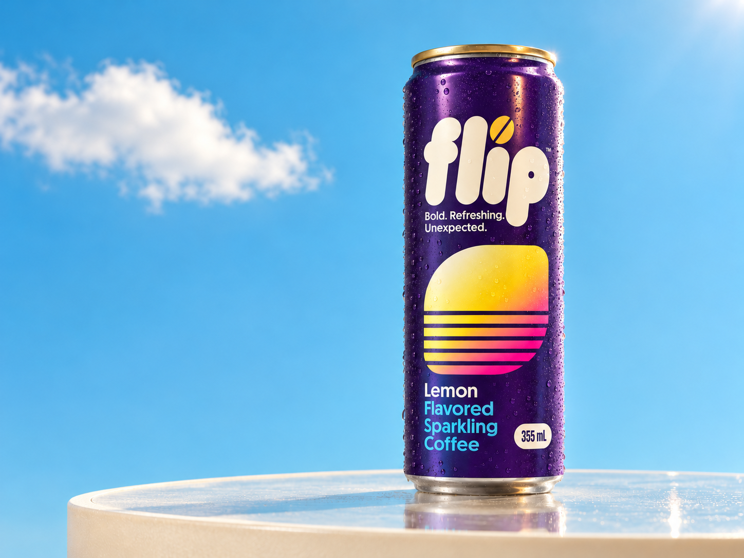 A complete purple FLIP Lemon can on a cream studio plinth against a blue sky with white clouds